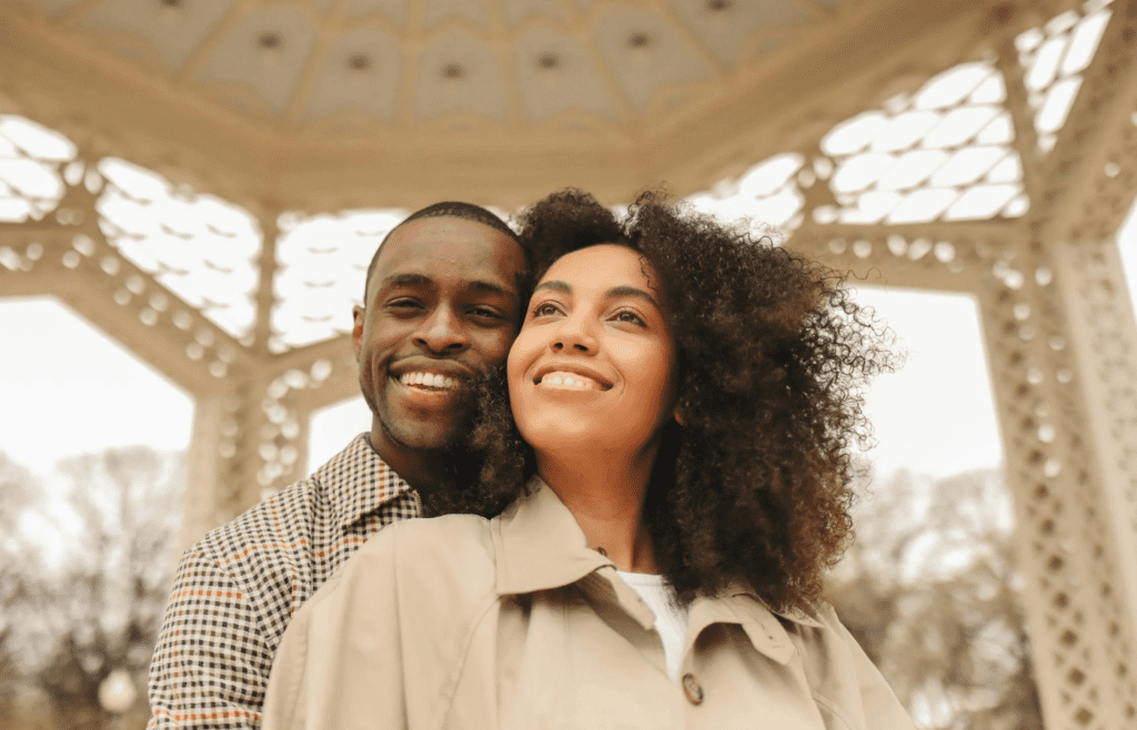 A partner smiling bashfully after a compliment