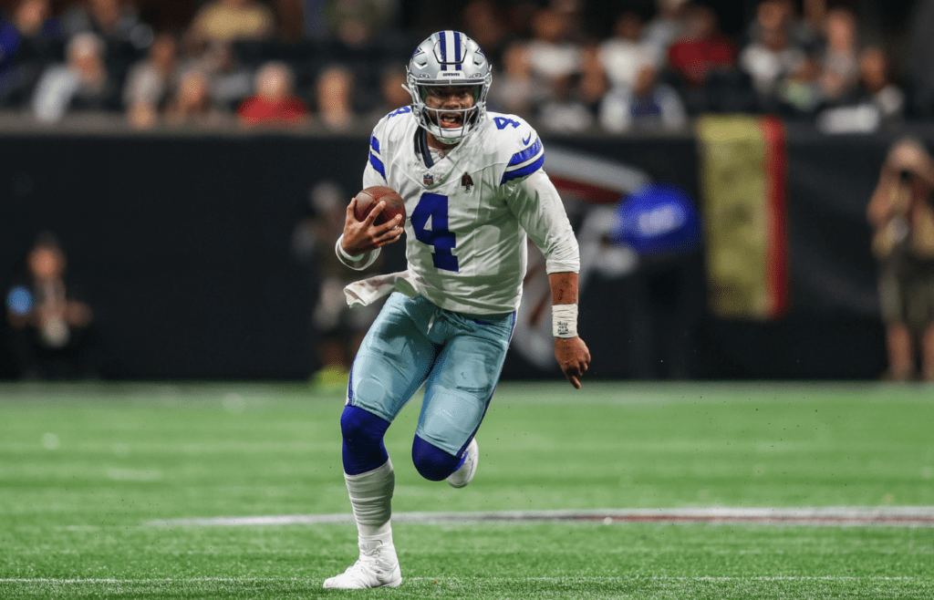 Nov 3, 2024; Atlanta, Georgia, USA; Dallas Cowboys quarterback Dak Prescott (4) scrambles against the Atlanta Falcons in the third quarter at Mercedes-Benz Stadium. Mandatory Credit: Brett Davis-Imagn Images