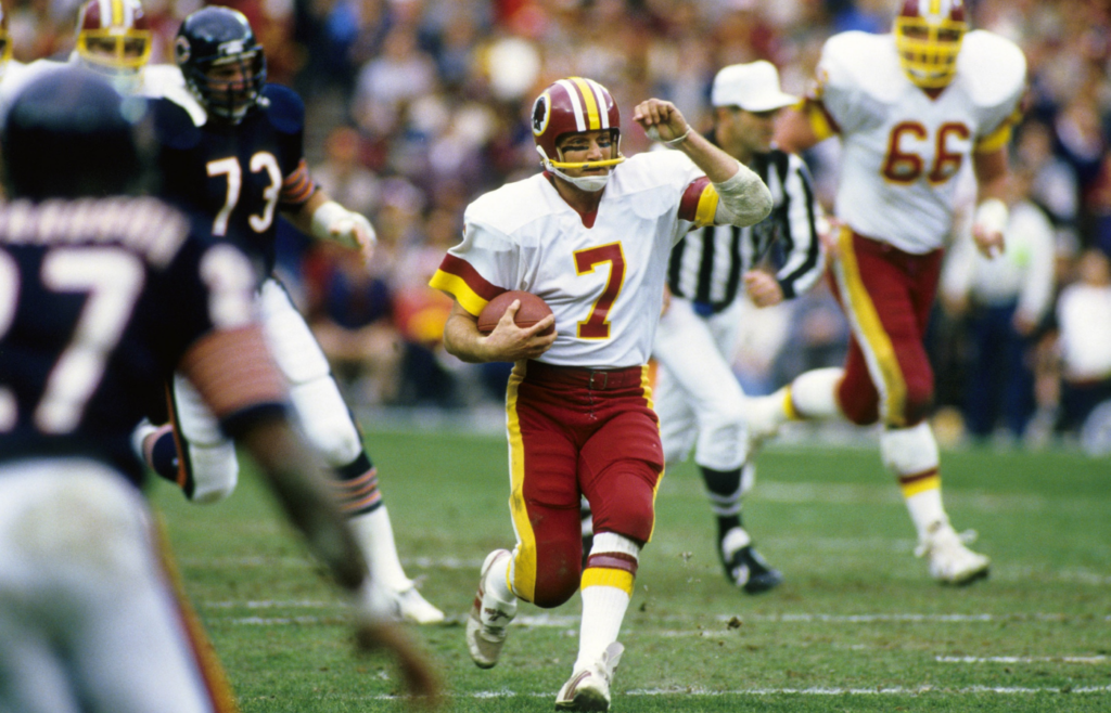 Dec 30, 1984; Washington, DC, USA; FILE PHOTO; Washington Redskins quarterback Joe Theismann (7) in action against the Chicago Bears during the 1984 NFC Divisional Playoff Game at RFK Stadium. The Bears won 23-19. Mandatory Credit: Manny Rubio-Imagn Images