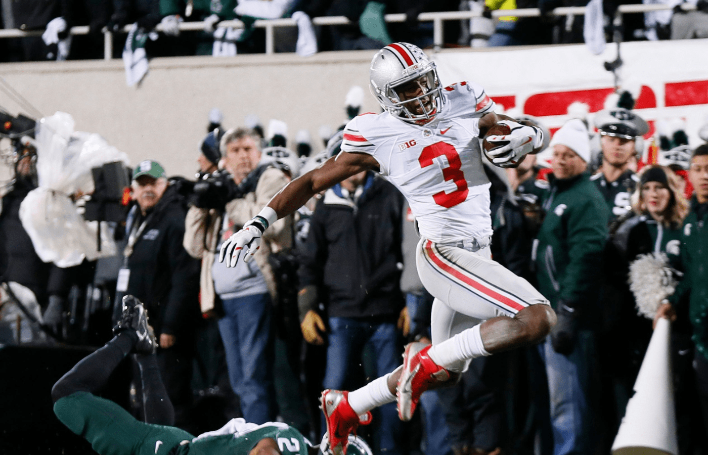 Ohio State Buckeyes wide receiver Michael Thomas (3) escapes tackle by Michigan State Spartans safety Kurtis Drummond (27) on his way to a 79-yard touchdown during the second quarter of the NCAA football game at Spartan Stadium in East Lansing, Michigan on Nov. 8, 2014. (Adam Cairns / The Columbus Dispatch)