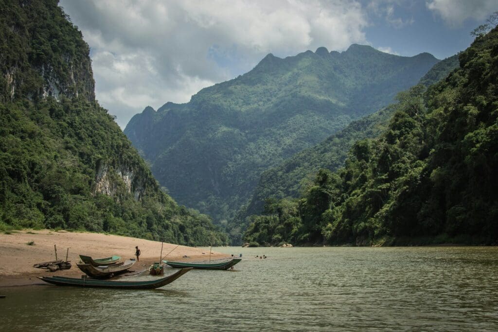 canoes on the beach in Laos