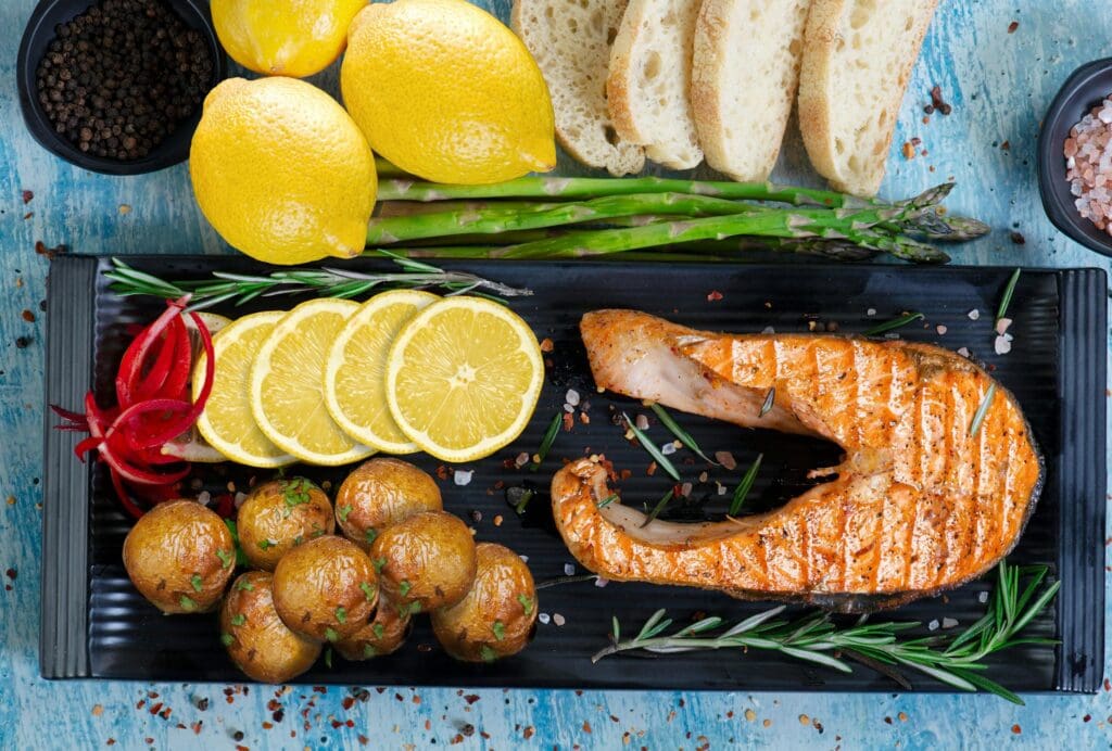 Fish fillets grilling on lemon slices