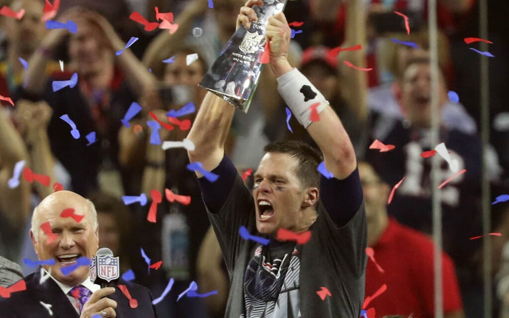 Super Bowl 51: New England Patriots quarterback Tom Brady celebrates with the Vince Lombardi Trophy on the podium after defeating the Atlanta Falcons 34-28 in overtime in Super Bowl LI at NRG Stadium on Feb 5, 2017.