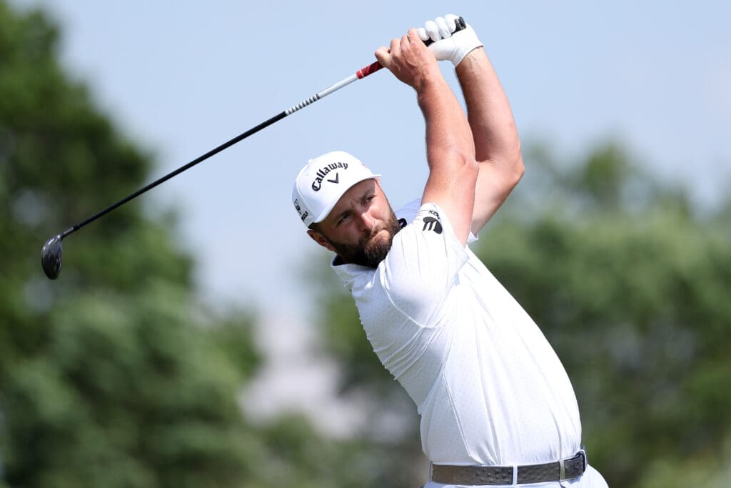 Jun 10, 2025; Oakmont, Pennsylvania, USA; Jon Rahm plays his shot from the 16th tee during a practice round for the U.S. Open golf tournament at Oakmont Country Club.