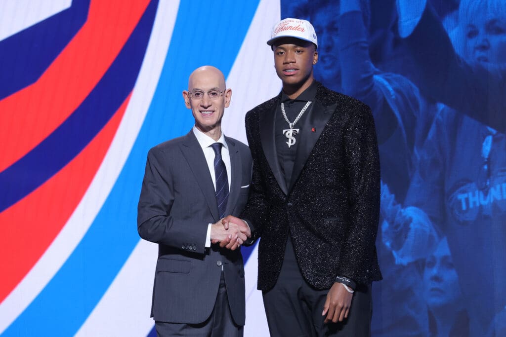 Jun 25, 2025; Brooklyn, NY, USA; Thomas Sorber stands with NBA commissioner Adam Silver after being selected as the 15th pick by the Oklahoma City Thunder in the first round of the 2025 NBA Draft at Barclays Center.