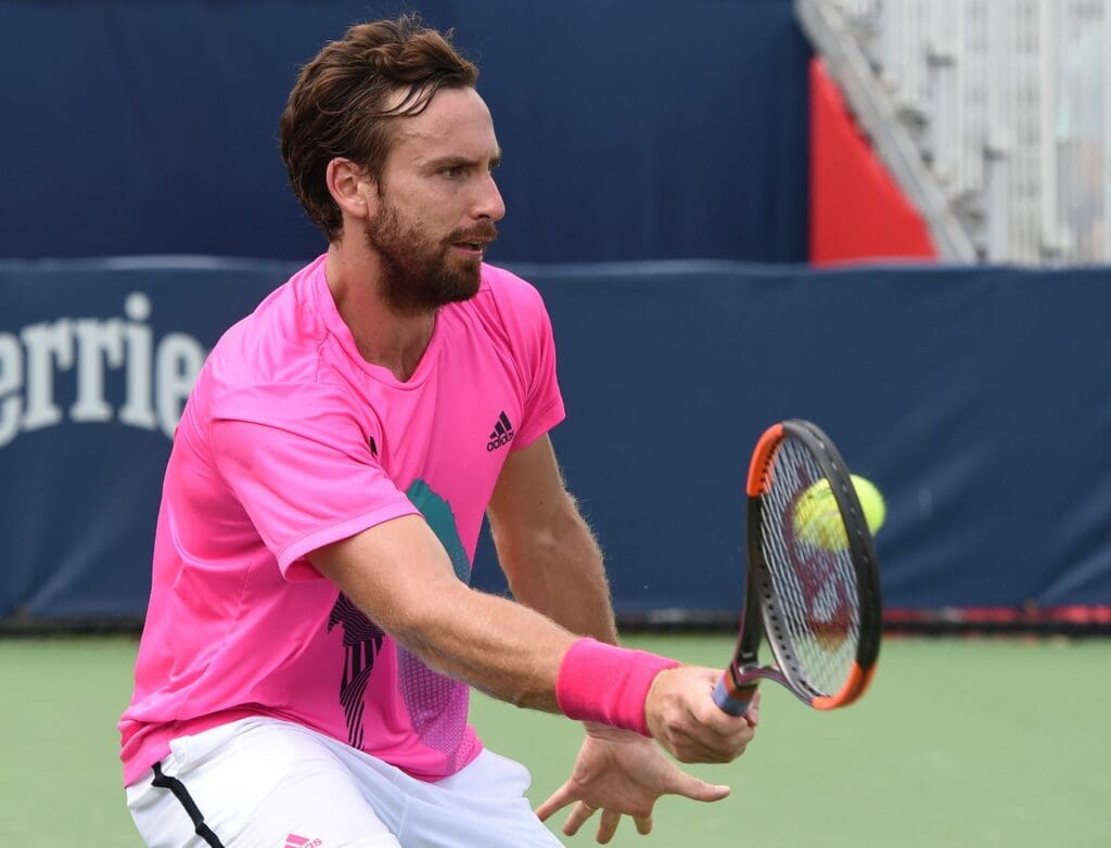 Aug 4, 2018; Toronto, Ontario, Canada; Ernests Gulbis of Latvia hits a shot against Ryan Harrison of the USA (not shown) in the Rogers Cup tennis tournament at Aviva Centre. Mandatory Credit: Dan Hamilton-USA TODAY Sports