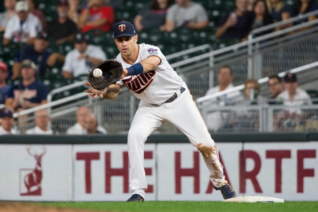Sep 11, 2018; Minneapolis, MN, USA; Minnesota Twins first baseman Joe Mauer (7) catches the ball for an out in the ninth inning against New York Yankees at Target Field. Mandatory Credit: Brad Rempel-USA TODAY Sports