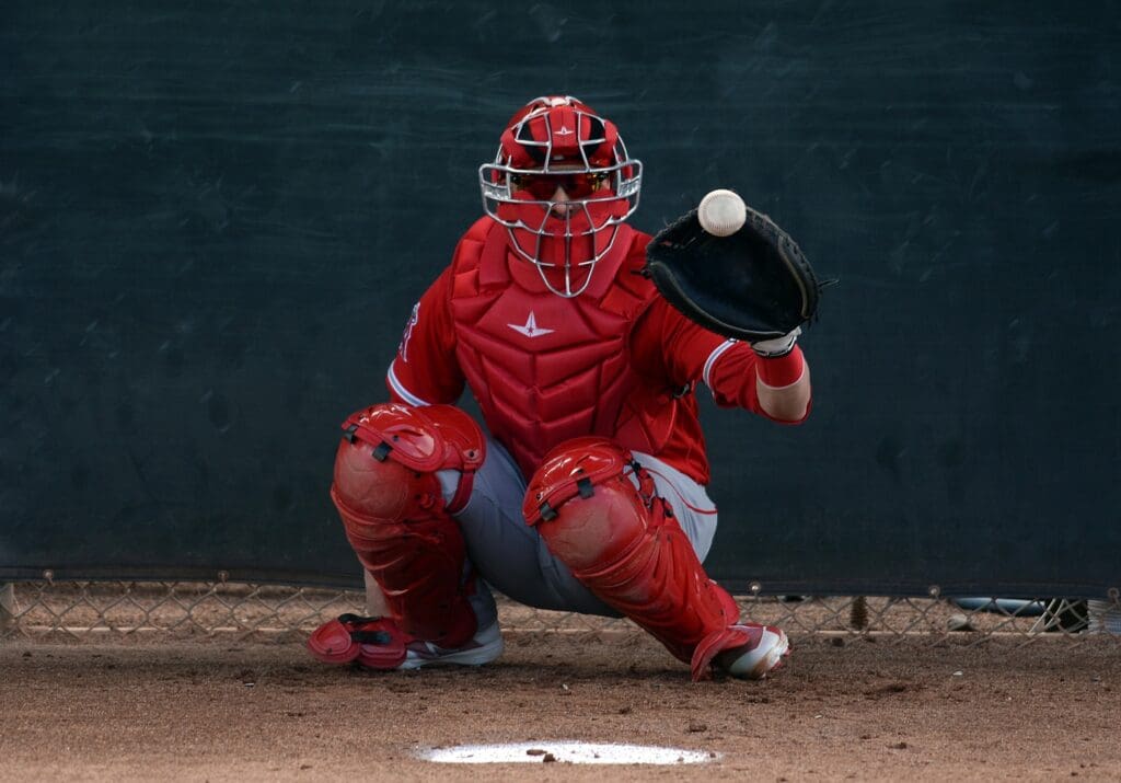 Feb 17, 2019; Tempe, AZ, USA; Los Angeles Angels catcher Jonathan Lucroy (20) catches during a spring training workout at the Tempe Diablo Stadium practice fields. Mandatory Credit: Joe Camporeale-USA TODAY Sports
