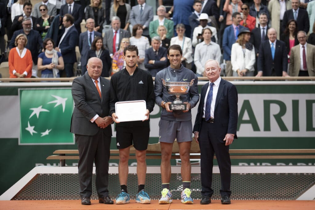 FFT president, Bernard Giudicelli (left) and Dominic Thiem (AUT) and Rafael Nadal (ESP) and Rod Laver (right) at the trophy presentation on day 15 at Stade Roland Garros.