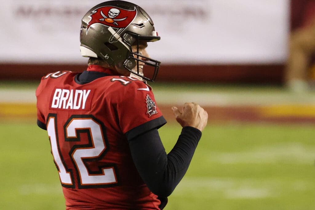 Jan 9, 2021; Landover, Maryland, USA; Tampa Bay Buccaneers quarterback Tom Brady (12) celebrates in the final two minutes against the Washington Football Team in the fourth quarter at FedExField. Mandatory Credit: Geoff Burke-USA TODAY Sports