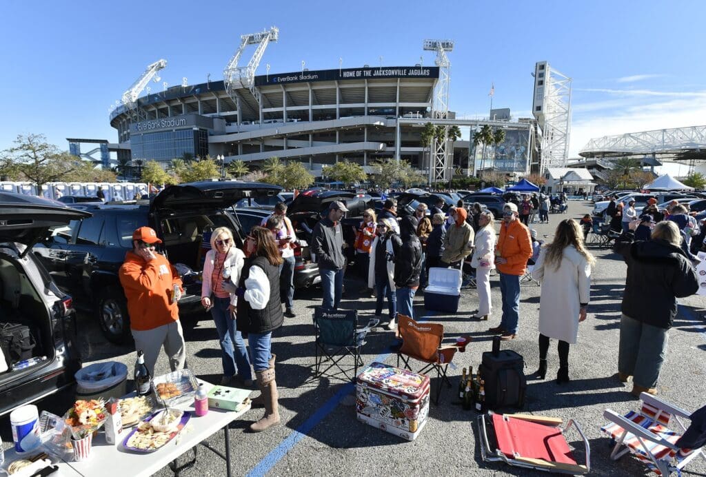 Fans tailgate in the parking lot outside EverBank Stadium ahead of the the Kentucky Wildcats taking on the Clemson Tigers Friday, December 29, 2023, in the TaxSlayer Gator Bowl in Jacksonville, Florida. [Bob Self/Florida Times-Union]
