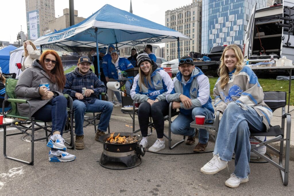 Nov 17, 2024; Detroit, Michigan, USA; The Trobel family pose for a picture while tailgating before the game between the Detroit Lions and the Jacksonville Jaguars at Ford Field. Mandatory Credit: David Reginek-Imagn Images