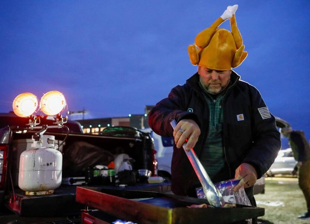 Brad Hanna cooks up some tailgate food before a game between the Green Bay Packers and Miami Dolphins on Thursday, November 28, 2024, at Lambeau Field in Green Bay, Wis.
Tork Mason/USA TODAY NETWORK-Wisconsin
