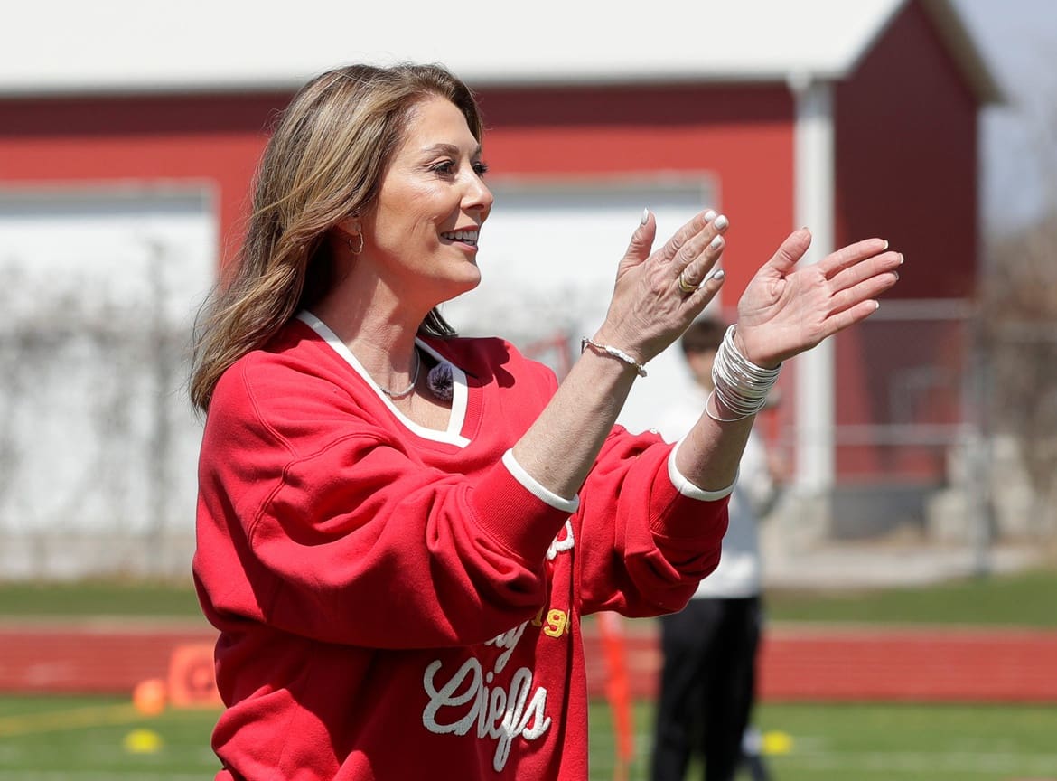 Randi Martin, mother of Kansas City Chiefs quarterback Patrick Mahomes, cheers on kids participating in the quarterback challenge during Field Fest on April 23, 2025, at City Stadium in Green Bay, Wis. The event was organized by the city of Green Bay and Greater Green Bay YMCA to celebrate NFL draft week.