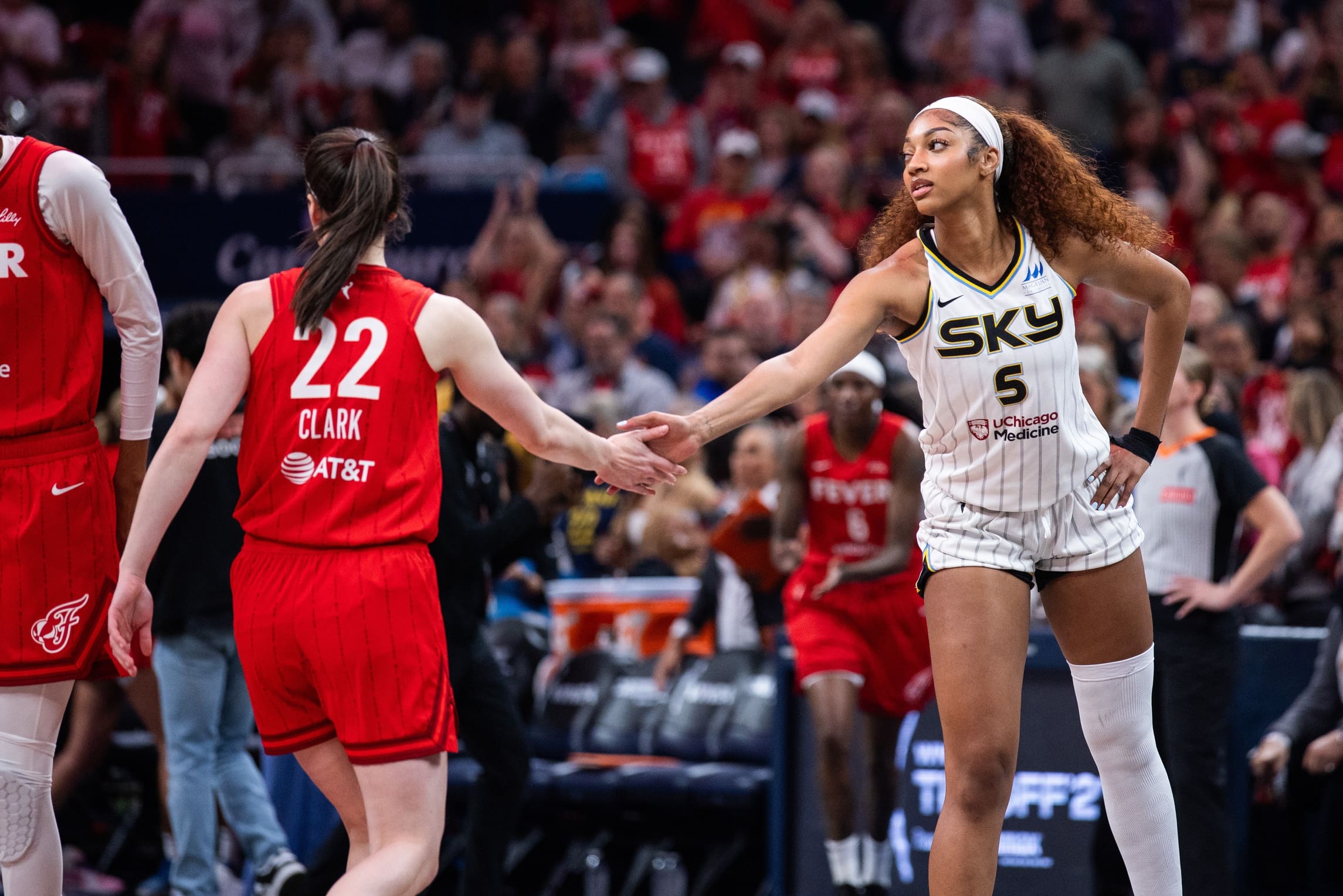 May 17, 2025; Indianapolis, Indiana, USA; Indiana Fever guard Caitlin Clark (22) and Chicago Sky forward Angel Reese (5) shake hands before the game at Gainbridge Fieldhouse. Mandatory Credit: Trevor Ruszkowski-Imagn Images