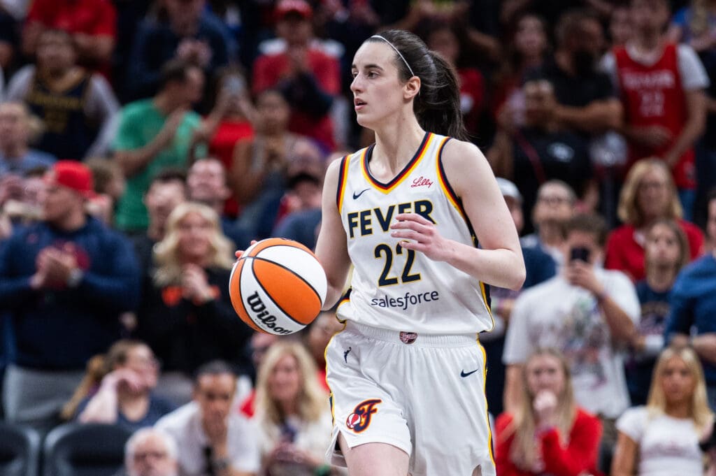 May 24, 2025; Indianapolis, Indiana, USA; Indiana Fever guard Caitlin Clark (22) dribbles the ball in the second half against the New York Liberty at Gainbridge Fieldhouse. Mandatory Credit: Trevor Ruszkowski-Imagn Images