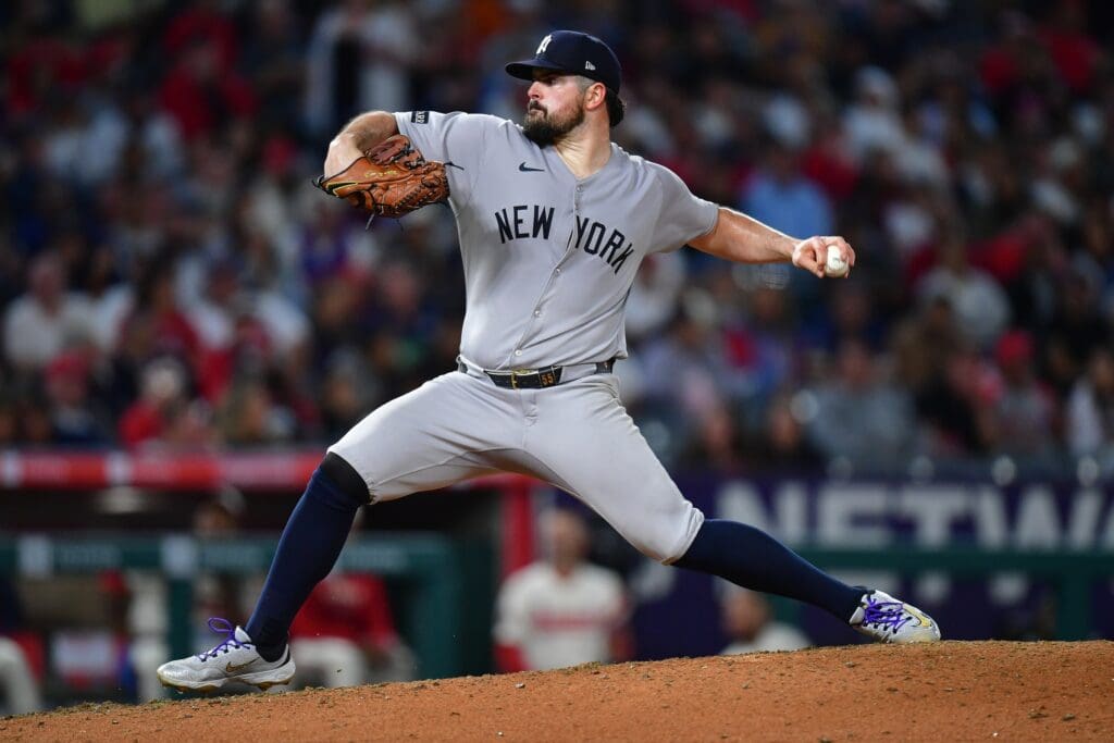 May 27, 2025; Anaheim, California, USA; New York Yankees pitcher Carlos Rodon (55) throws against the Los Angeles Angels during the seventh inning at Angel Stadium. Mandatory Credit: Gary A. Vasquez-Imagn Images