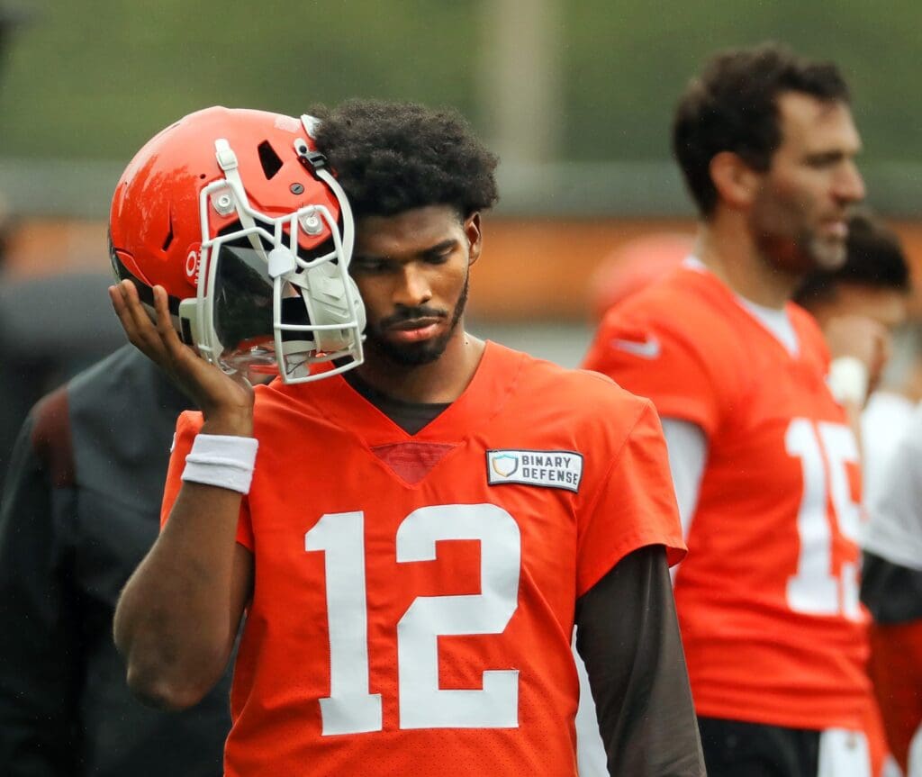 Cleveland Browns quarterback Shedeur Sanders (12) listens to the play calling on the sideline during an NFL practice at the Cleveland Browns training facility on Wednesday, May 28, 2025, in Berea, Ohio.