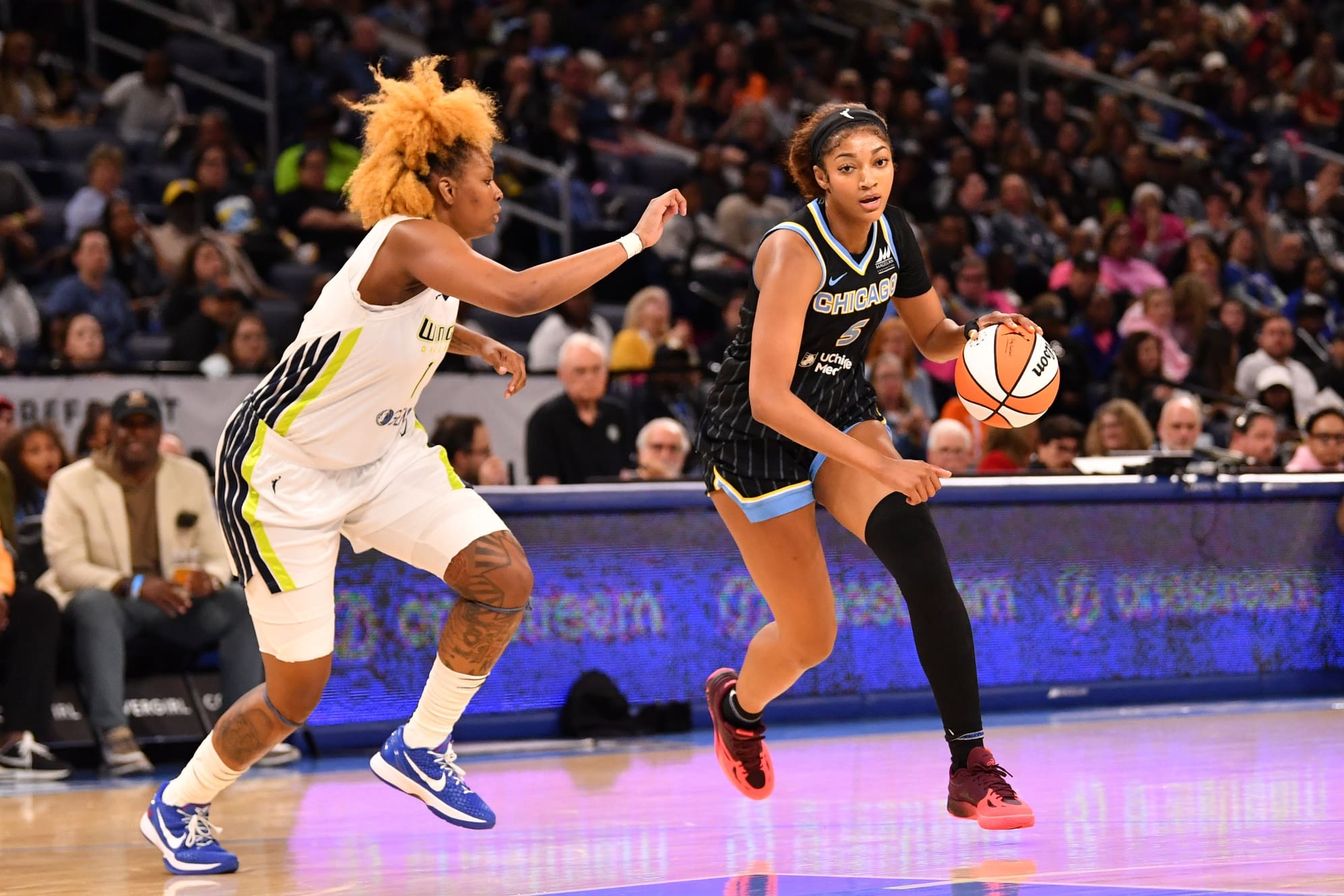 May 29, 2025; Chicago, Illinois, USA; Chicago Sky forward Angel Reese (5) drives towards the basket during the first half against the Dallas Wings at the Wintrust Arena. Mandatory Credit: Patrick Gorski-Imagn Images