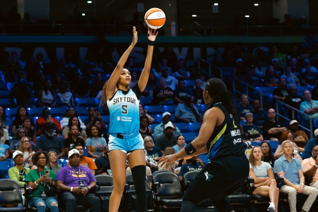 May 31, 2025; Arlington, Texas, USA; Chicago Sky forward Angel Reese (5) shoots as Dallas Wings forward Myisha Hines-Allen (2) defends during the first half at College Park Center. Mandatory Credit: Chris Jones-Imagn Images