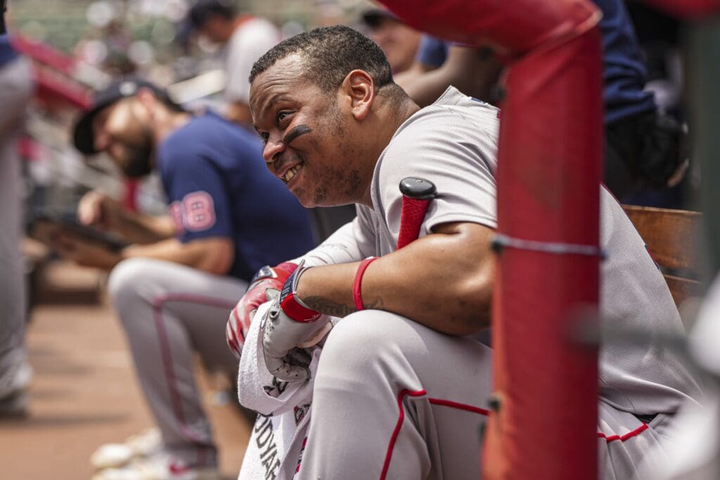 Jun 1, 2025; Cumberland, Georgia, USA; Boston Red Sox designated hitter Rafael Devers (11) watches a promotion on the scoreboard during the game against the Atlanta Braves at Truist Park. Mandatory Credit: Dale Zanine-Imagn Images