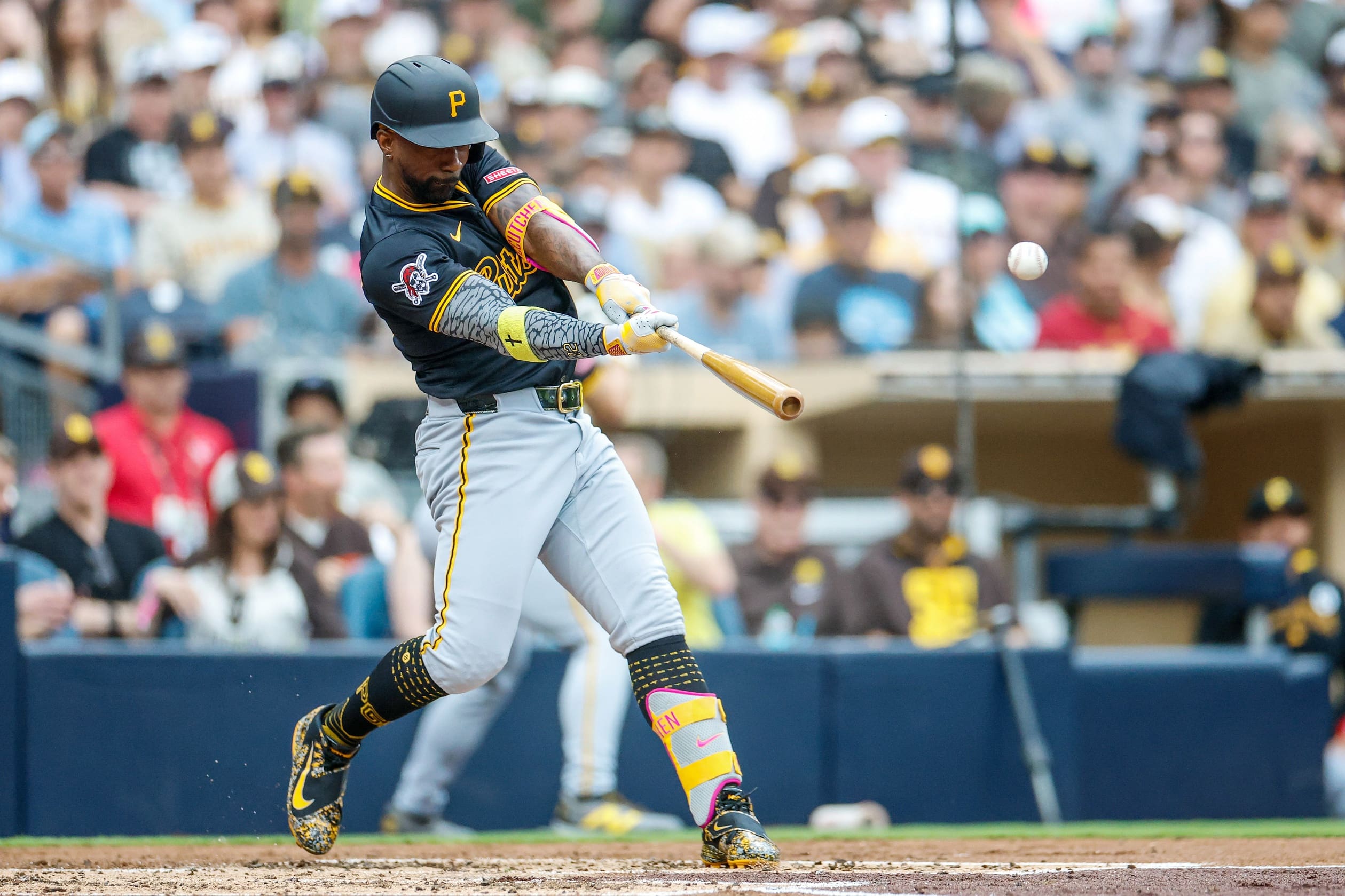 Jun 1, 2025; San Diego, California, USA; Pittsburgh Pirates designated hitter Andrew McCutchen (22) hits a two run home run during the third inning against the San Diego Padres at Petco Park. Mandatory Credit: David Frerker-Imagn Images