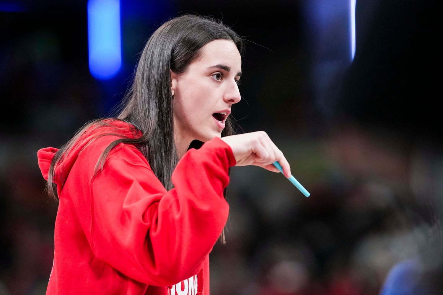 Indiana Fever guard Caitlin Clark (22) talks with an official during a timeout Tuesday, June 3, 2025, at a game between the Indiana Fever and the Washington Mystics at Gainbridge Fieldhouse in Indianapolis.