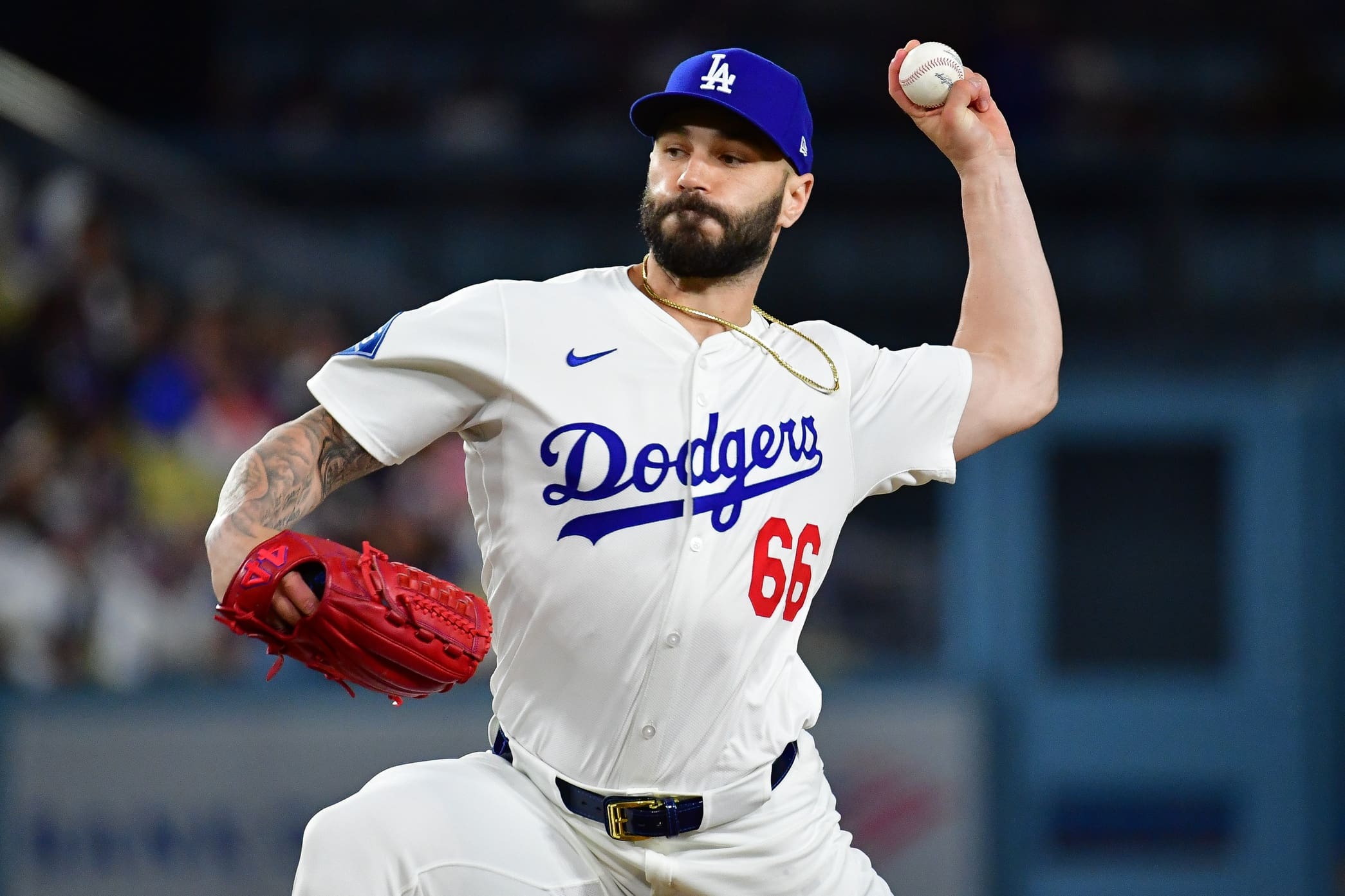 June 3, 2025; Los Angeles, California, USA; Los Angeles Dodgers pitcher Tanner Scott (66) throws against the New York Mets during the tenth inning at Dodger Stadium. Mandatory Credit: Gary A. Vasquez-Imagn Images