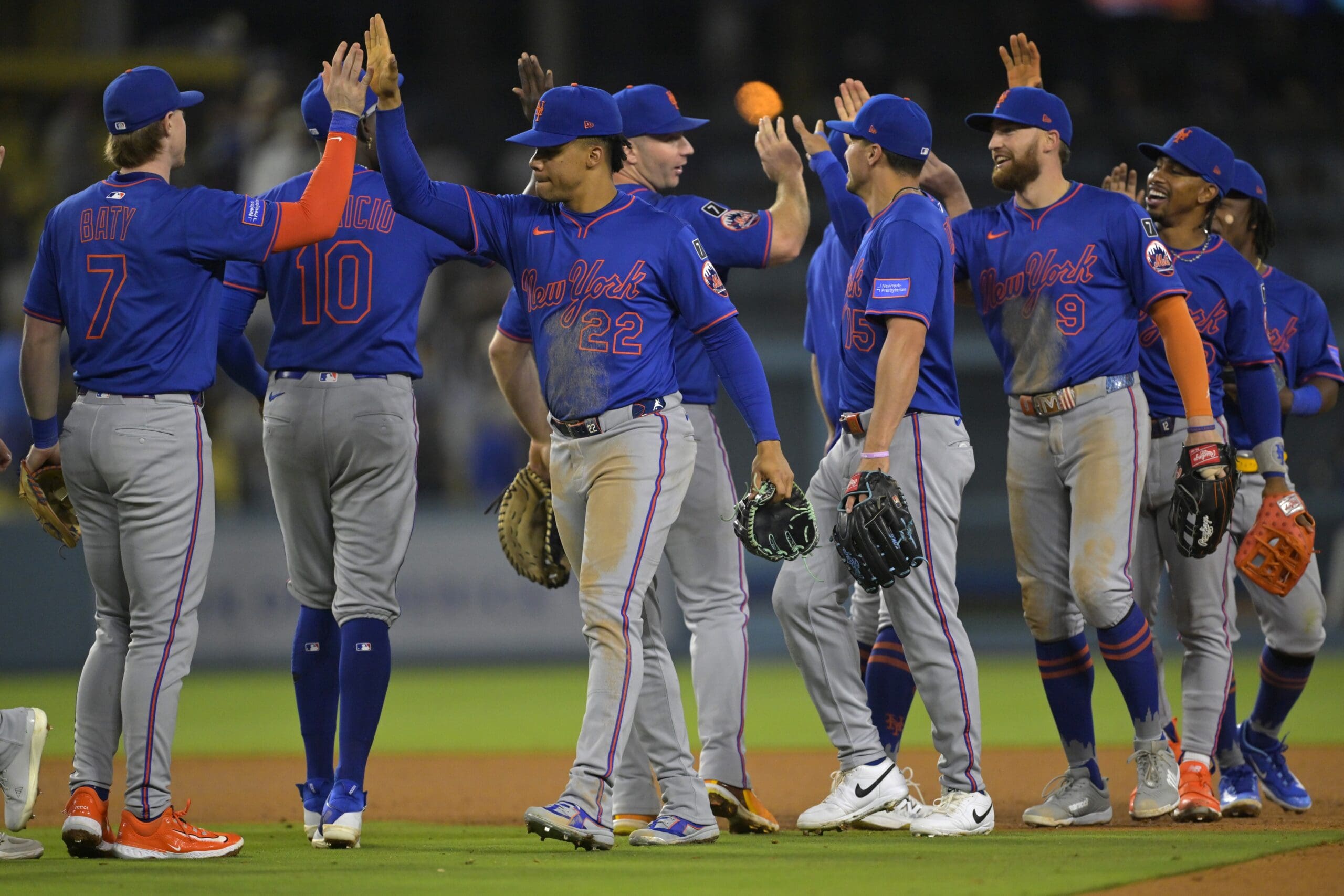 Jun 4, 2025; Los Angeles, California, USA; New York Mets players celebrate after the final out of the ninth inning against the Los Angeles Dodgers at Dodger Stadium. Mandatory Credit: Jayne Kamin-Oncea-Imagn Images