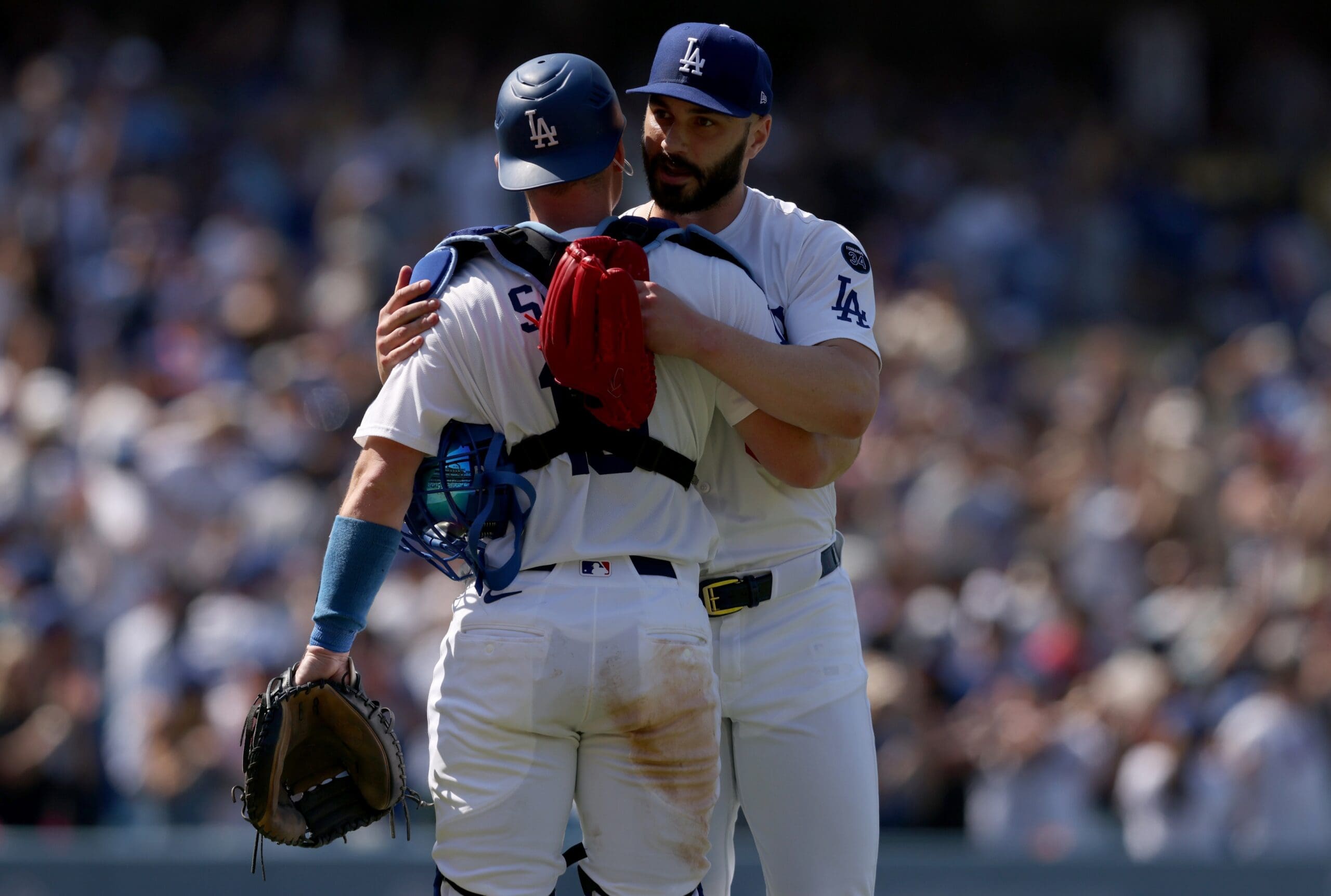 Jun 5, 2025; Los Angeles, California, USA; Los Angeles Dodgers pitcher Tanner Scott (66) and Los Angeles Dodgers catcher Will Smith (16) celebrate after defeating the New York Mets at Dodger Stadium. Mandatory Credit: Jason Parkhurst-Imagn Images