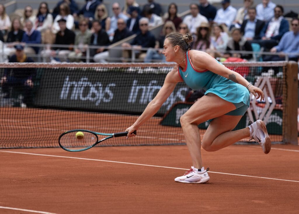 Jun 7, 2025; Paris, FR; Aryna Sabalenka returns a shot during the womenÕs singles final against Coco Gauff of the United States on day 14 at Roland Garros Stadium. Mandatory Credit: Susan Mullane-Imagn Images