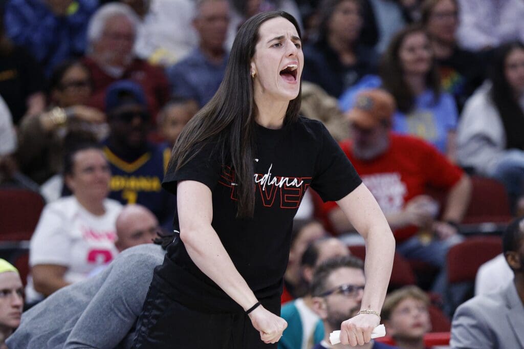Jun 7, 2025; Chicago, Illinois, USA; Indiana Fever guard Caitlin Clark (22)reacts to a basket scored by a teammate against the Chicago Sky during the first half of a WNBA game at United Center. Mandatory Credit: Kamil Krzaczynski-Imagn Images