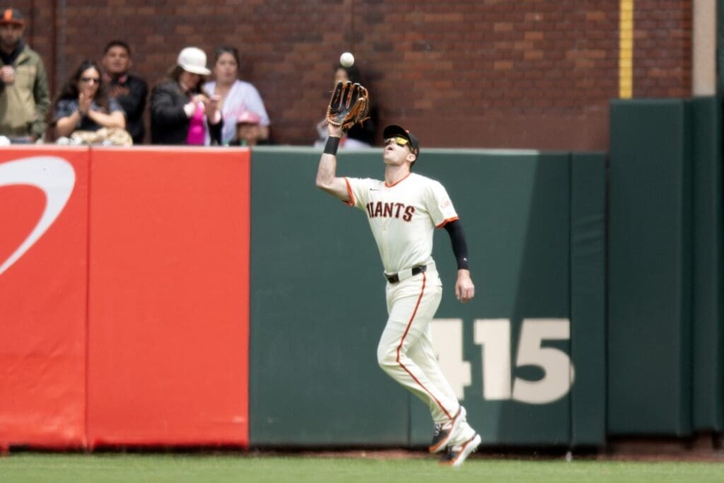 Jun 8, 2025; San Francisco, California, USA; San Francisco Giants right fielder Mike Yastrzemski (5) makes the catch of a fly ball by Atlanta Braves catcher Sean Murphy during the fourth inning at Oracle Park. Mandatory Credit: D. Ross Cameron-Imagn Images
