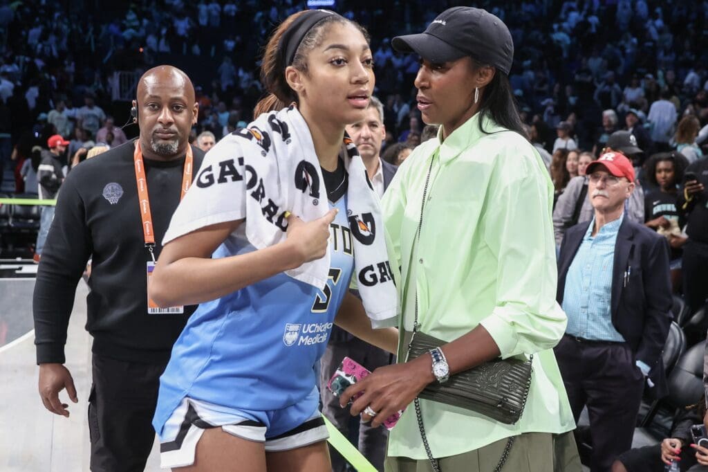 Jun 10, 2025; Brooklyn, New York, USA; Chicago Sky forward Angel Reese (5) talks with former professional basketball player Lisa Leslie following the game against the New York Liberty at Barclays Center. Mandatory Credit: Wendell Cruz-Imagn Images