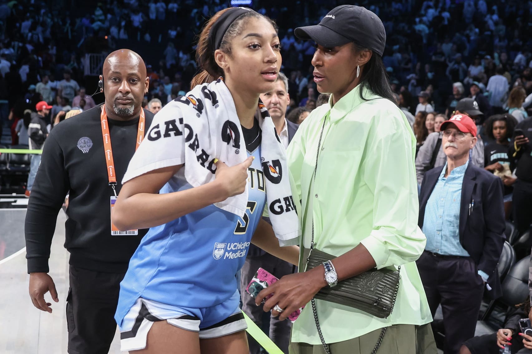 Jun 10, 2025; Brooklyn, New York, USA; Chicago Sky forward Angel Reese (5) talks with former professional basketball player Lisa Leslie following the game against the New York Liberty at Barclays Center. Mandatory Credit: Wendell Cruz-Imagn Images