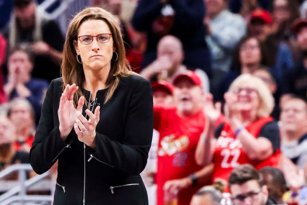 Indiana Fever head coach Stephanie White cheers for her team Saturday, June 14, 2025, during a game between the Indiana Fever and the New York Liberty at Gainbridge Fieldhouse in Indianapolis. The Indiana Fever defeated the New York Liberty, 102-88.