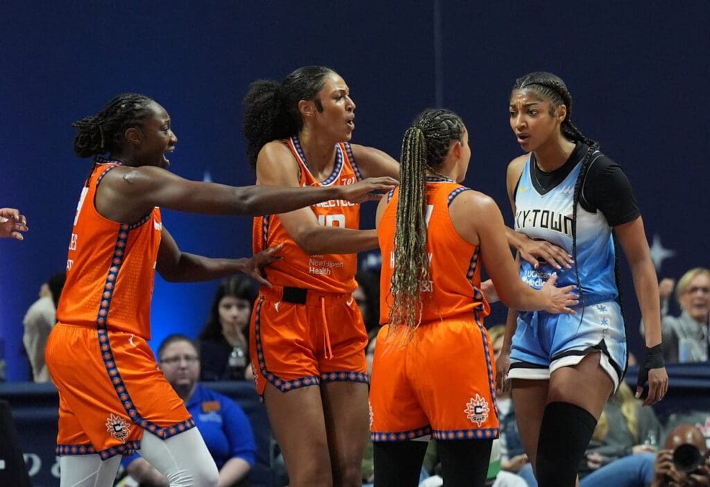 Jun 15, 2025; Uncasville, Connecticut, USA; Chicago Sky forward Angel Reese (5) and Connecticut Sun guard Bria Hartley (14) have words in the second half at Mohegan Sun Arena. Mandatory Credit: David Butler II-Imagn Images
