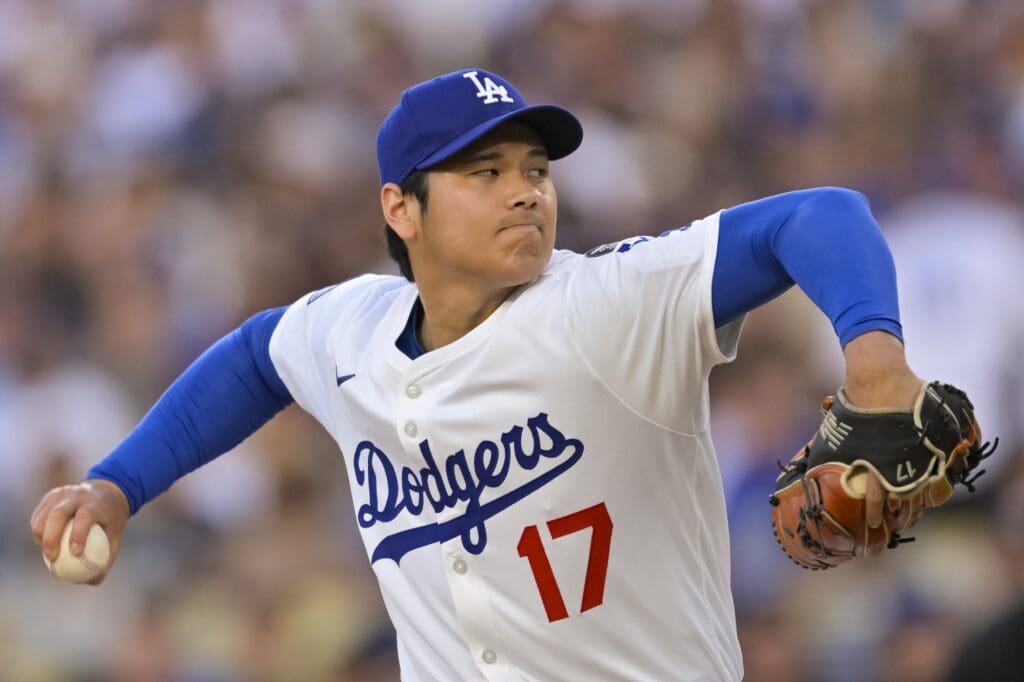Jun 16, 2025; Los Angeles, California, USA; Los Angeles Dodgers designated hitter Shohei Ohtani (17) throws against the San Diego Padres during the first inning at Dodger Stadium. Mandatory Credit: Jayne Kamin-Oncea-Imagn Images