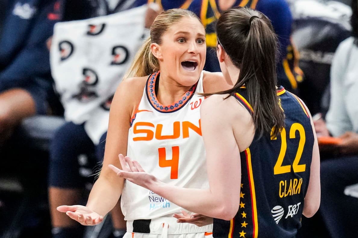 Connecticut Sun guard Jacy Sheldon (4) and Indiana Fever guard Caitlin Clark (22) express frustration with each other Tuesday, June 17, 2025, during a game between the Indiana Fever and the Connecticut Sun at Gainbridge Fieldhouse in Indianapolis.