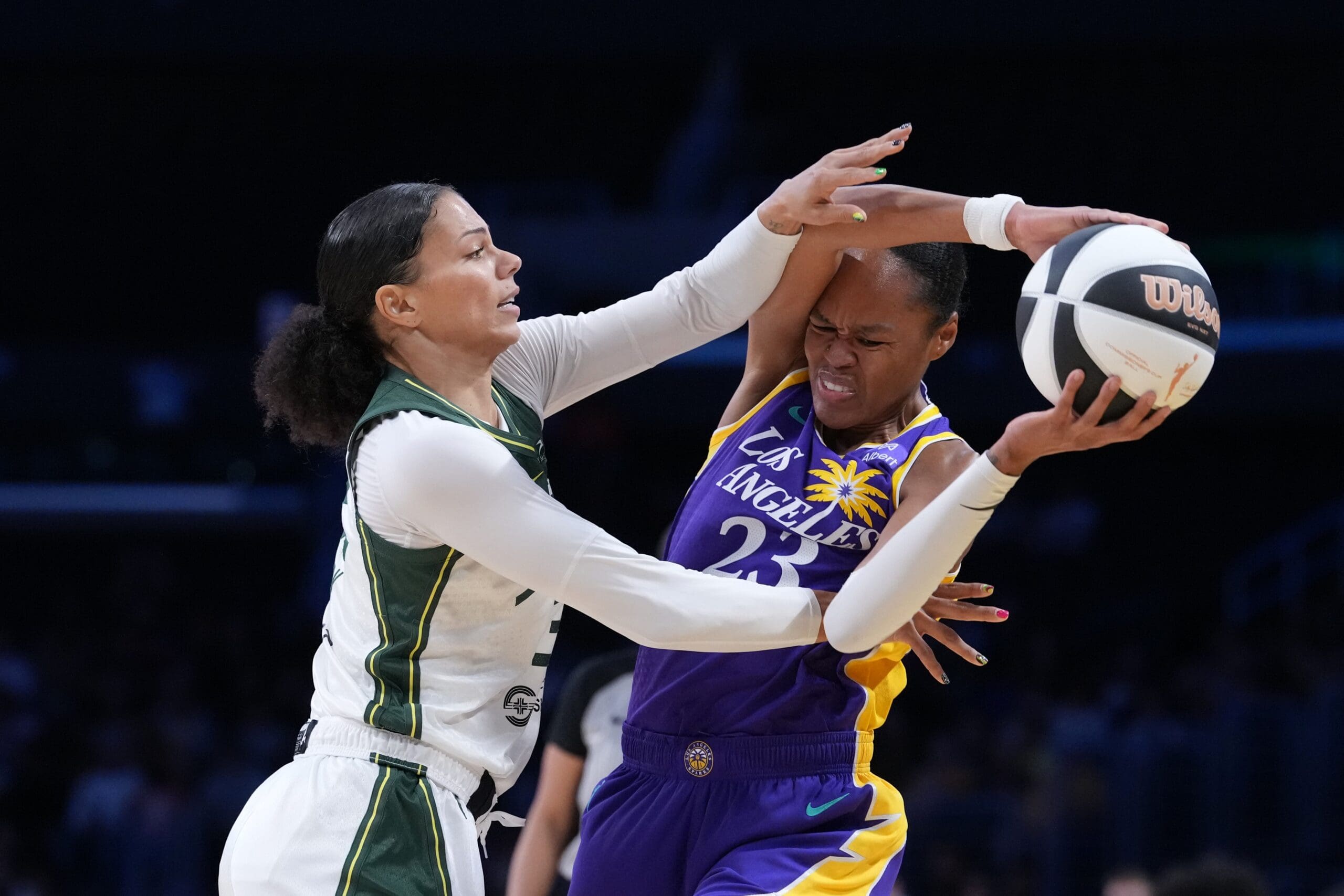 Jun 17, 2025; Los Angeles, California, USA; LA Sparks forward Azura Stevens (23) is defended by Seattle Storm forward Alysha Clark (32) in the first half at Crypto.com Arena. Mandatory Credit: Kirby Lee-Imagn Images