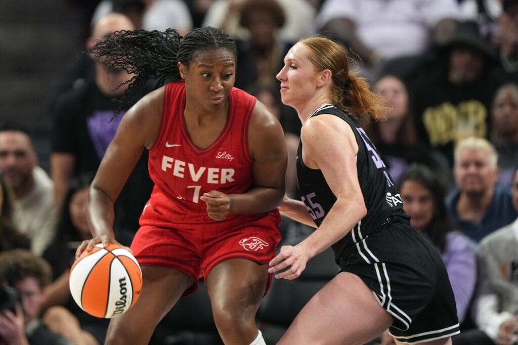 Jun 19, 2025; San Francisco, California, USA; Indiana Fever forward Aliyah Boston (7) dribbles against Golden State Valkyries forward Chloe Bibby (55) during the second quarter at Chase Center. Mandatory Credit: Darren Yamashita-Imagn Images