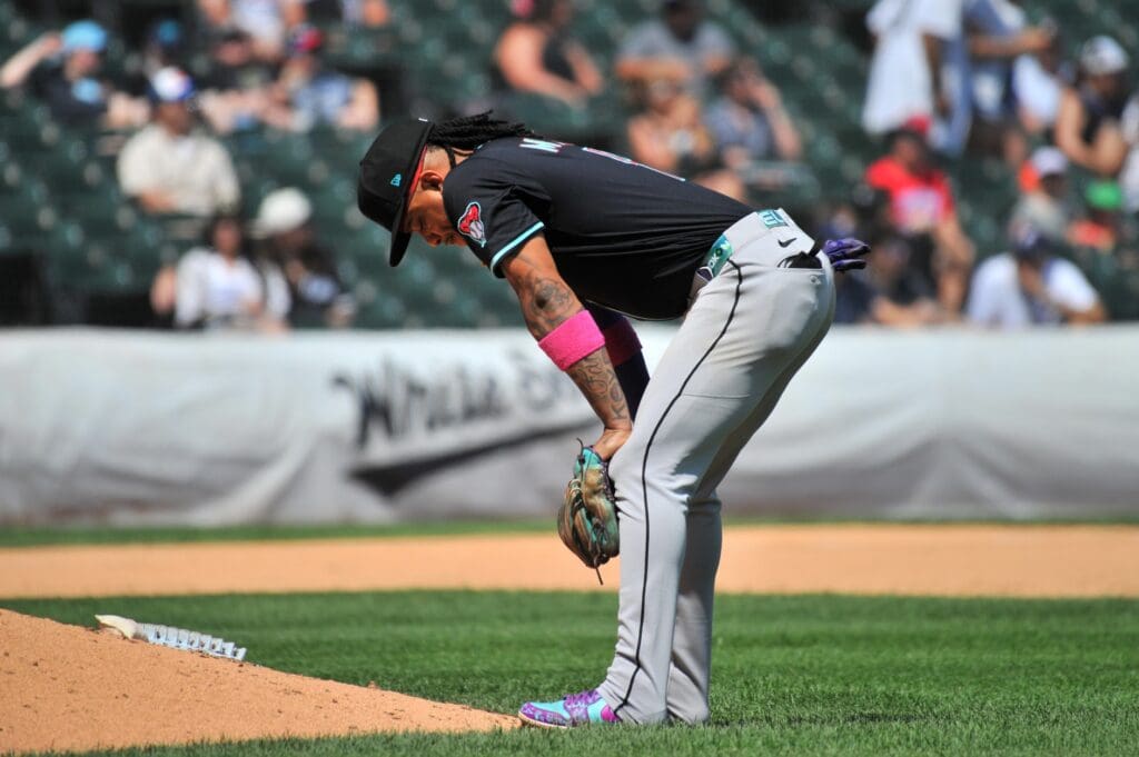 Jun 25, 2025; Chicago, Illinois, USA; Arizona Diamondbacks second baseman Ketel Marte (4) rests during the sixth inning against the Chicago White Sox at Rate Field. Mandatory Credit: Patrick Gorski-Imagn Images