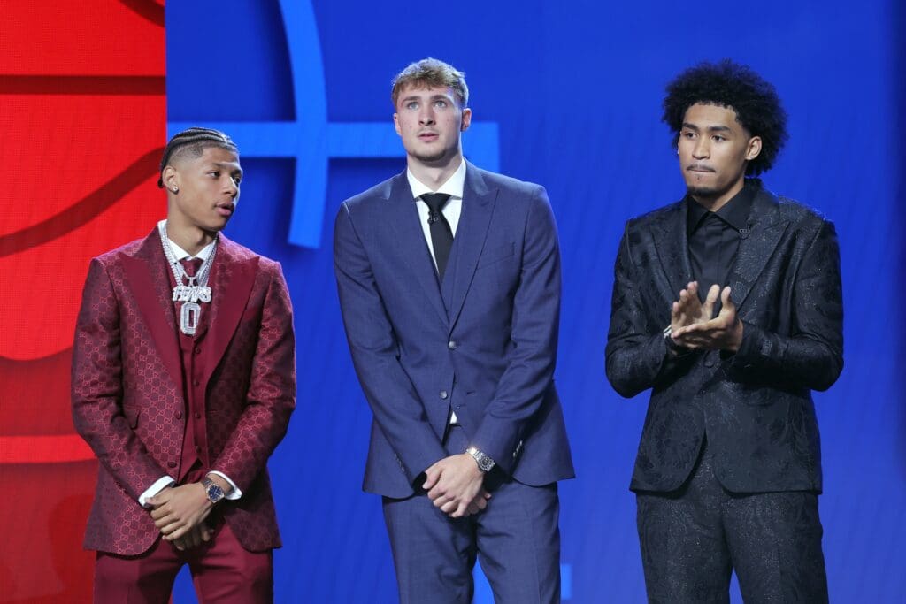 Jun 25, 2025; Brooklyn, NY, USA; Jeremiah Fears, Cooper Flagg, and Dylan Harper stand on stage before the 2025 NBA Draft at Barclays Center. Mandatory Credit: Brad Penner-Imagn Images