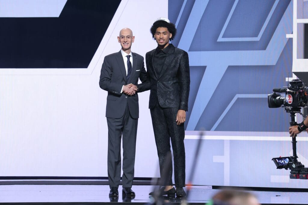 Jun 25, 2025; Brooklyn, NY, USA; Dylan Harper stands with NBA commissioner Adam Silver after being selected as the second pick by the San Antonio Spurs in the first round of the 2025 NBA Draft at Barclays Center.