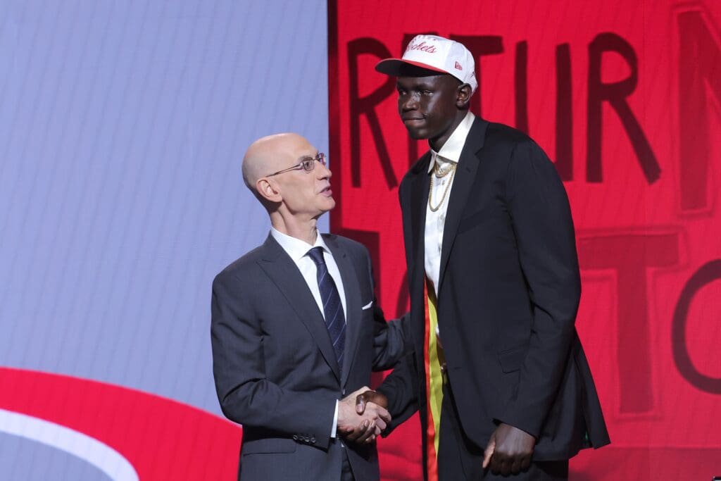 Jun 25, 2025; Brooklyn, NY, USA; Khaman Maluach stands with NBA commissioner Adam Silver after being selected as the tenth pick by the Houston Rockets in the first round of the 2025 NBA Draft at Barclays Center.