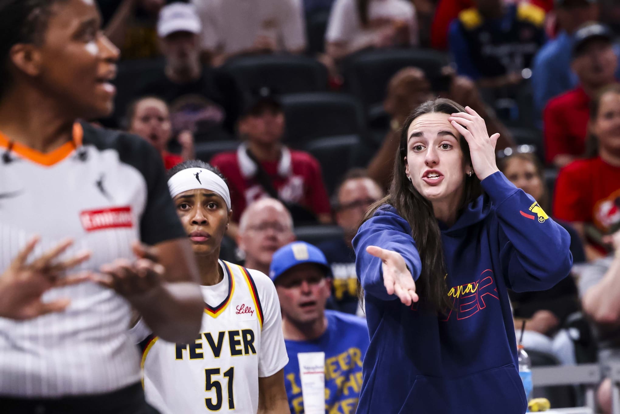 Jun 26, 2025; Indianapolis, Indiana, USA; Indiana Fever guard Caitlin Clark (22) reacts to the action against the Los Angeles Sparks during the first half at Gainbridge Fieldhouse. Mandatory Credit: Grace Smith/INDIANAPOLIS STAR-Imagn Images