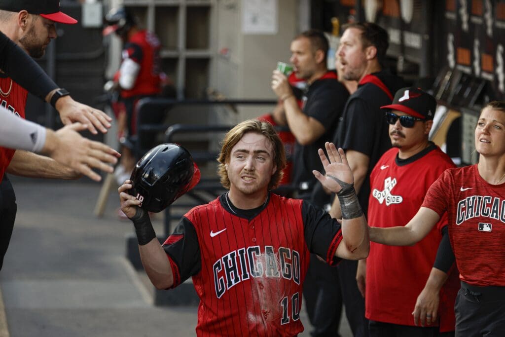 Jun 27, 2025; Chicago, Illinois, USA; Chicago White Sox shortstop Chase Meidroth (10) celebrates with teammates in the dugout after scoring against the San Francisco Giants during the first inning at Rate Field. Mandatory Credit: Kamil Krzaczynski-Imagn Images