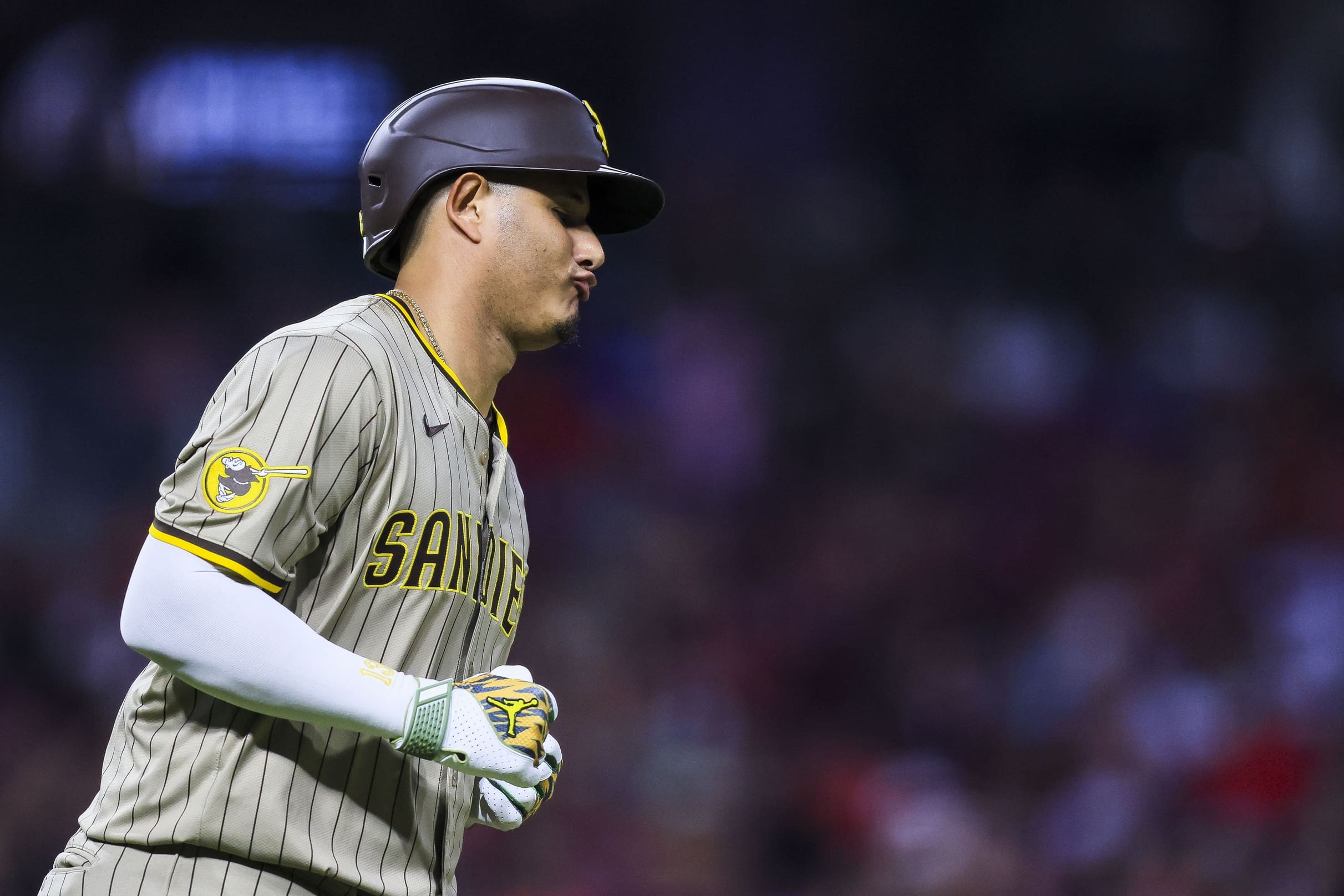 Jun 27, 2025; Cincinnati, Ohio, USA; San Diego Padres third baseman Manny Machado (13) reacts after a play in the seventh inning against the Cincinnati Reds at Great American Ball Park. Mandatory Credit: Katie Stratman-Imagn Images