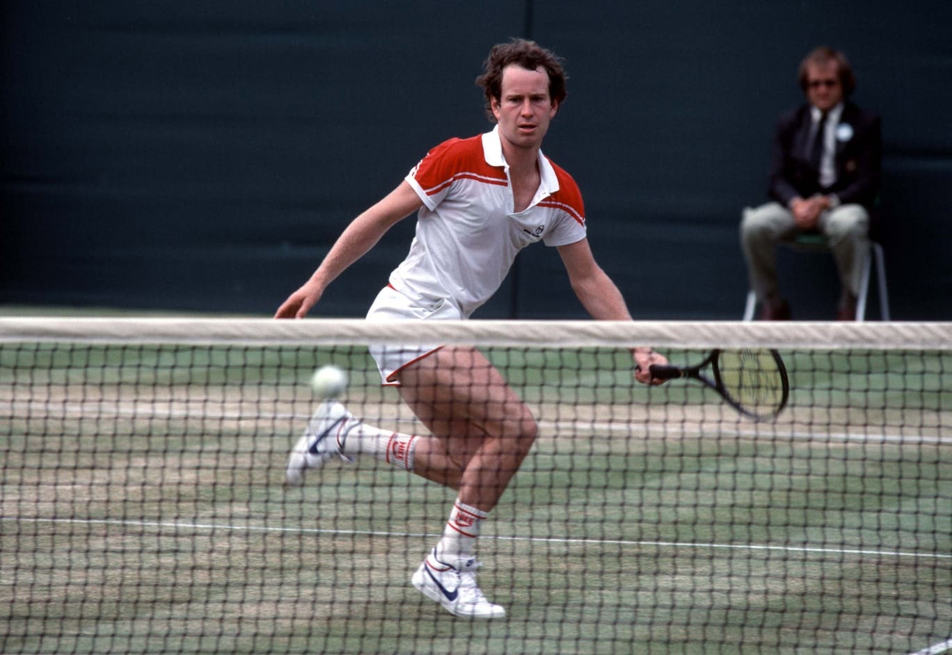 Jun 29, 1983; London, ENGLAND; FILE PHOTO; John McEnroe (USA) comes to the net and prepares to return a shot during the 1983 Wimbledon Championships at the All England Lawn Tennis Club. Mandatory Credit: Gerry Cranham/Offside Sports via USA TODAY Sports