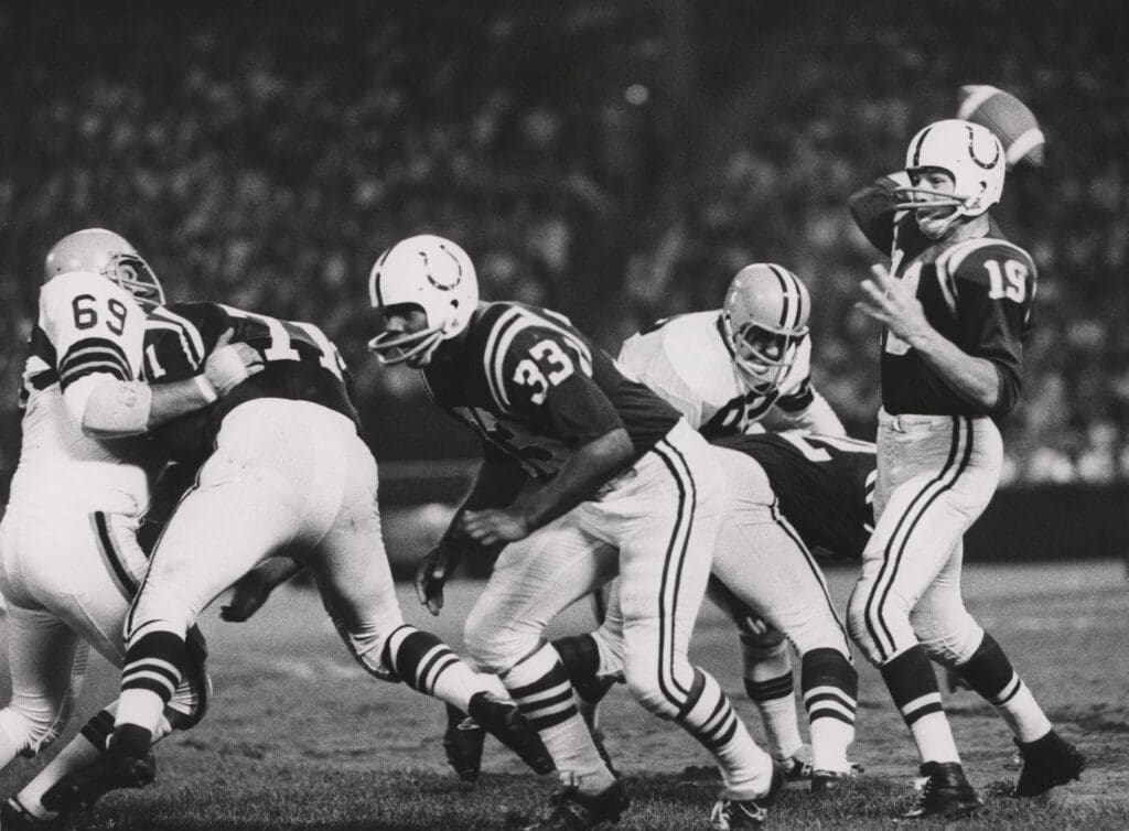 Oct 14, 1962; Cleveland, OH, USA; FILE PHOTO: Baltimore Colts Hall of Fame quarterback (19) JOHNNY UNITAS throws a pass against the Cleveland Browns at Cleveland Stadium. The Colts won the game 36-14. Mandatory Credit: Tony Tomsic-USA TODAY NETWORK Copyright © 1962 Tony Tomsic